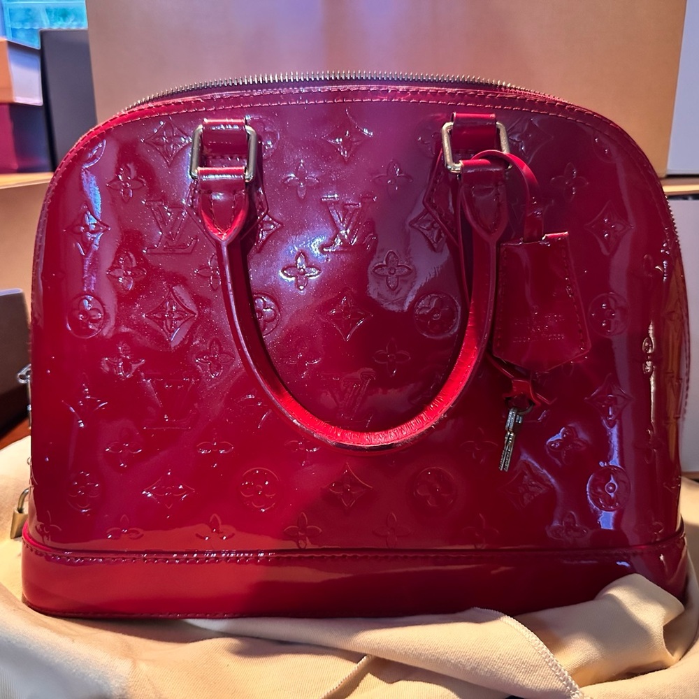 Louis Vuitton Alma patent leather handbag